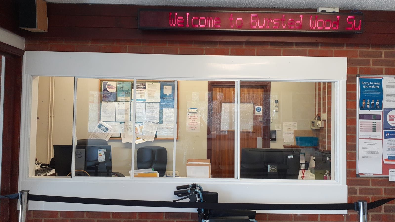 counter at reception with a wheelchair in front