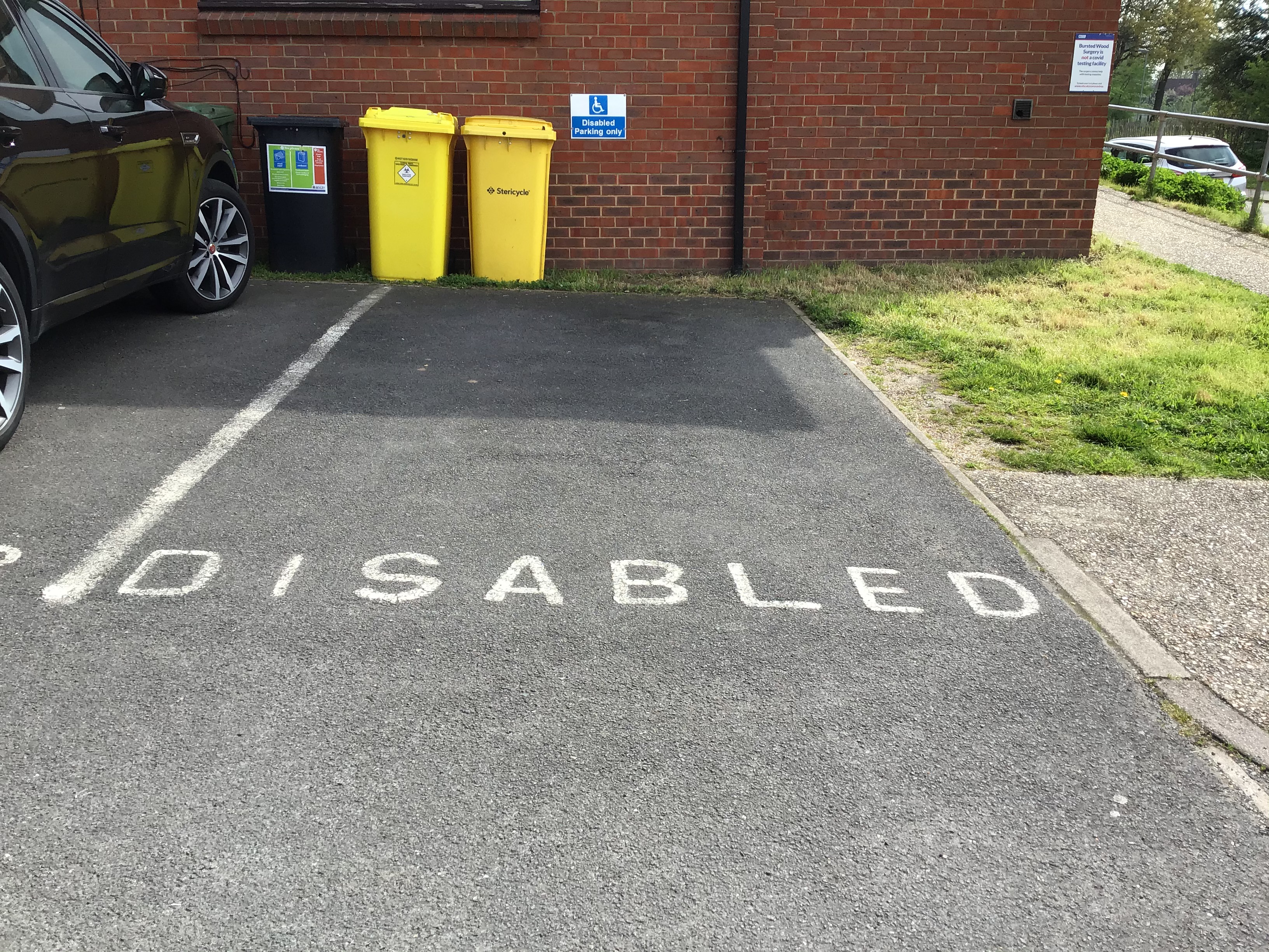 a parking bay labled as disabled